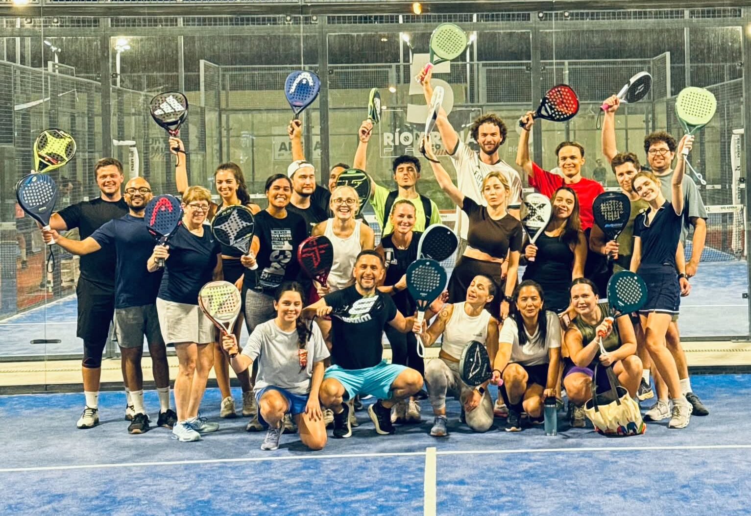 COMMON open social padel players together on court in Madrid